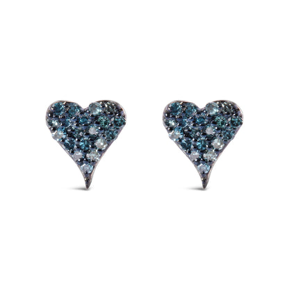 Front angle view of a pair of white metal heart-shaped earrings adorned with round prong-set blue gemstones.