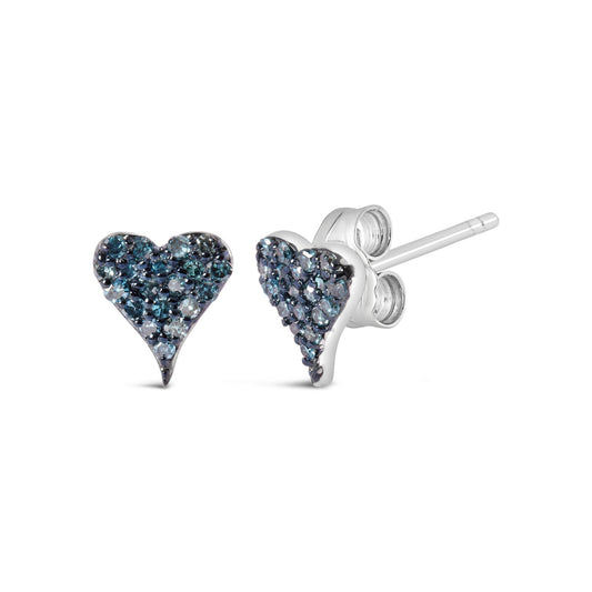 Pair of white metal heart-shaped stud earrings with small round blue gemstones in prong settings, shown in a close-up front and side angle view.