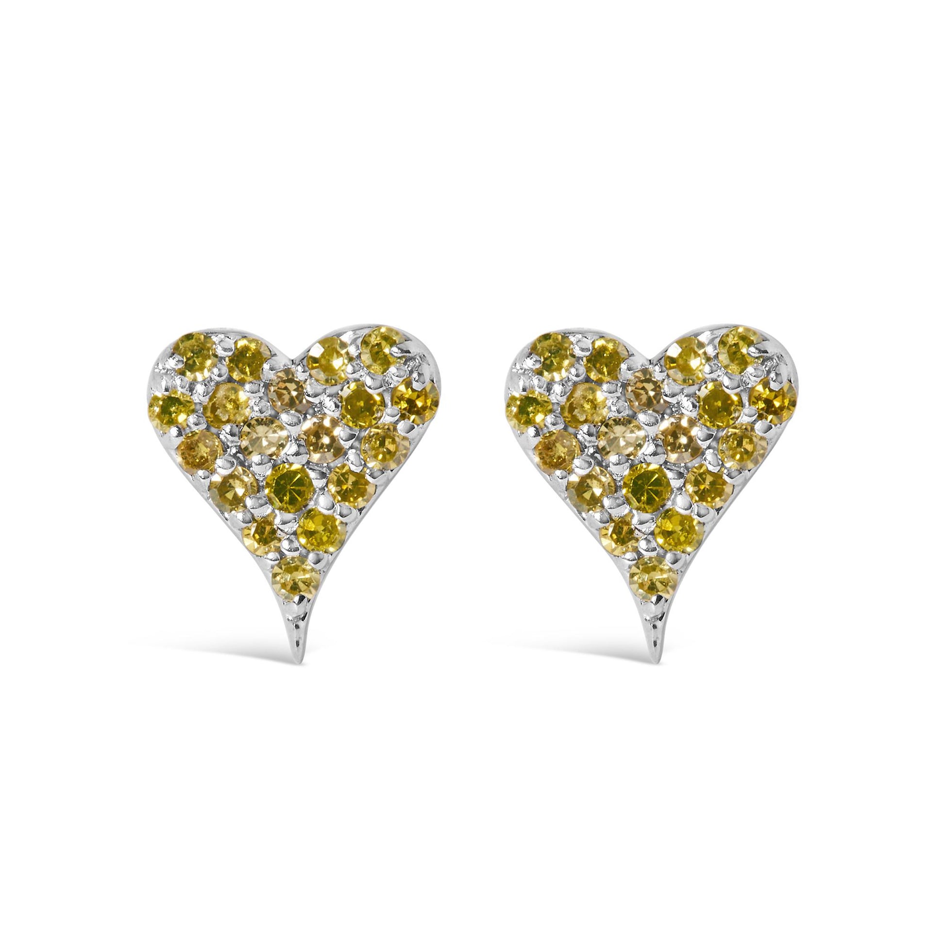 Front-facing view of white metal heart-shaped earrings decorated with multiple round yellow gemstones in prong settings.