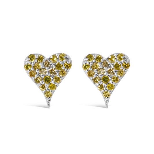 Front-facing view of white metal heart-shaped earrings decorated with multiple round yellow gemstones in prong settings.