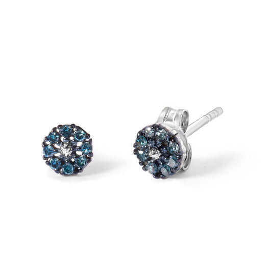 Pair of white metal stud earrings with round blue gemstones in prong setting, shown in a close-up angled view on a white background.