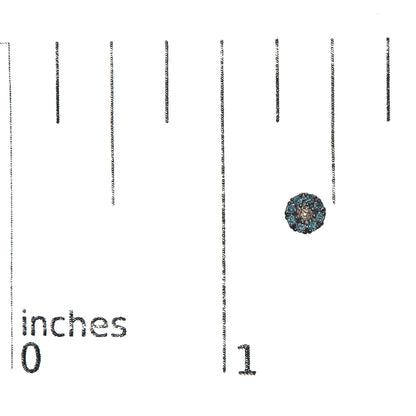 Close-up top view of a white metal round stud earring with prong-set blue gemstones, placed on a ruler for size reference.