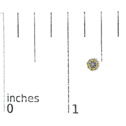 White metal round stud earring with prong-set yellow gemstones arranged in a cluster, shown on a ruler for size reference, top-down angle.