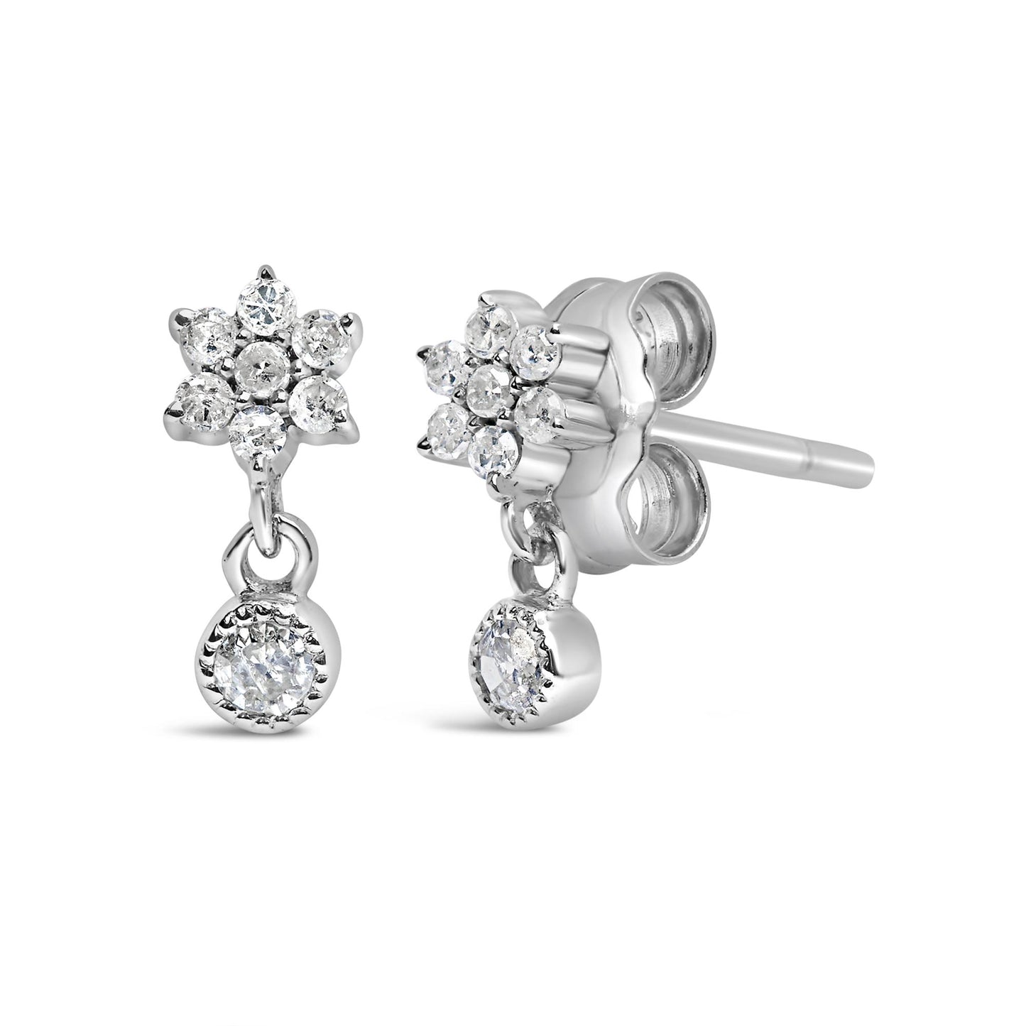 Front and side angled view of white metal stud earrings with round white gemstones in a floral cluster and a dangling round gemstone.