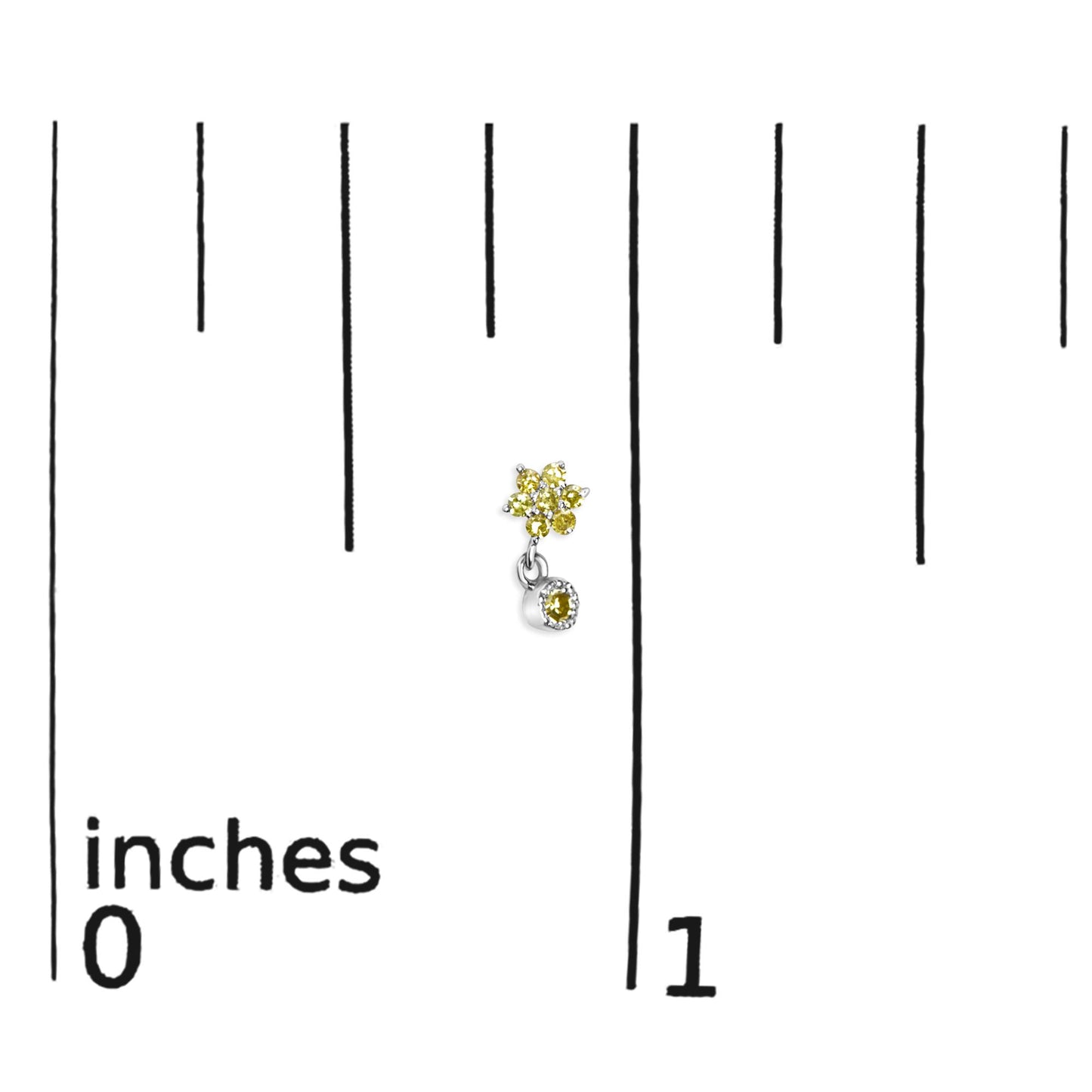 Close-up front view of white metal earrings with cluster of yellow round gemstones in prong setting and a single dangling yellow round gemstone, placed on a ruler for size reference.
