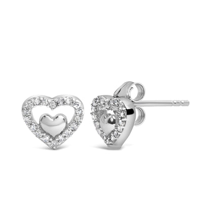 Pair of white metal heart-shaped stud earrings with small round white gemstones surrounding a solid heart center, shown in a front and side angle view.