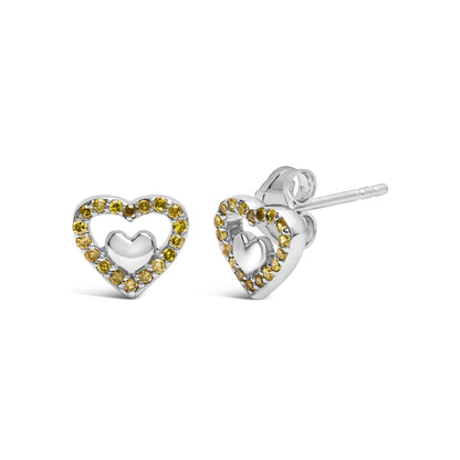 Pair of white metal heart-shaped stud earrings with round yellow gemstones set in prongs around the outer edge, shown from front and side angles on a white background.