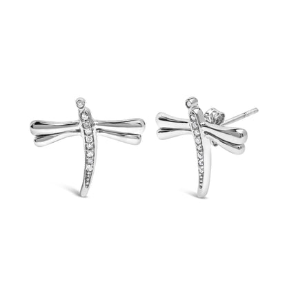 Pair of white metal dragonfly-shaped earrings with prong-set round white gemstones along the body, shown from a front and side angle on a white background.