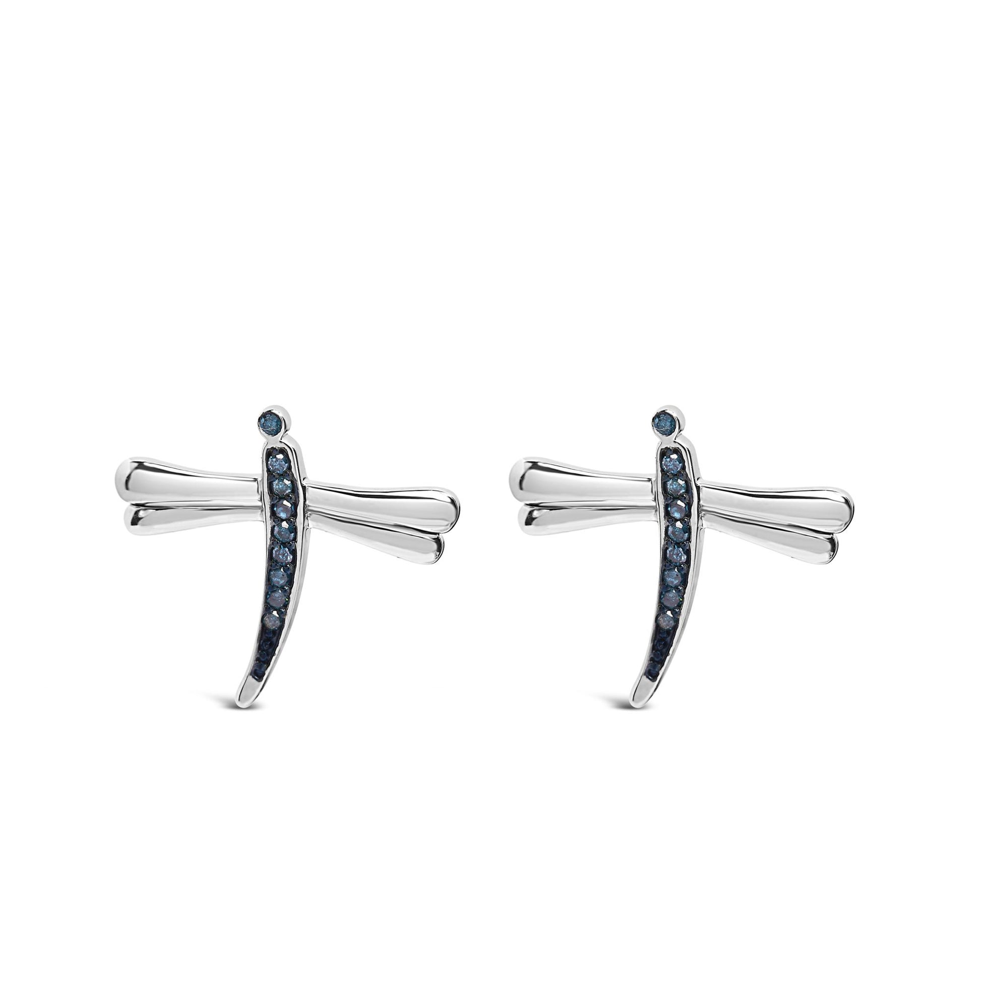 Front view of white earrings shaped like dragonflies with prong-set round blue gemstones along the body.