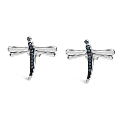 Pair of white metal dragonfly-shaped earrings with prong-set round blue gemstones, front-facing angle.