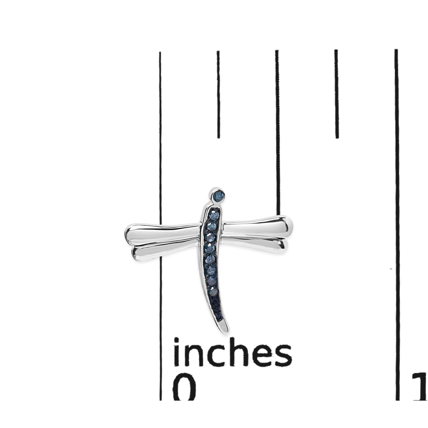 Close-up front view of white metal dragonfly-shaped earring with blue round prong-set gemstones, displayed on a ruler for size reference.