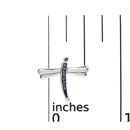 Close-up front view of white metal dragonfly-shaped earring with blue round prong-set gemstones, displayed on a ruler for size reference.