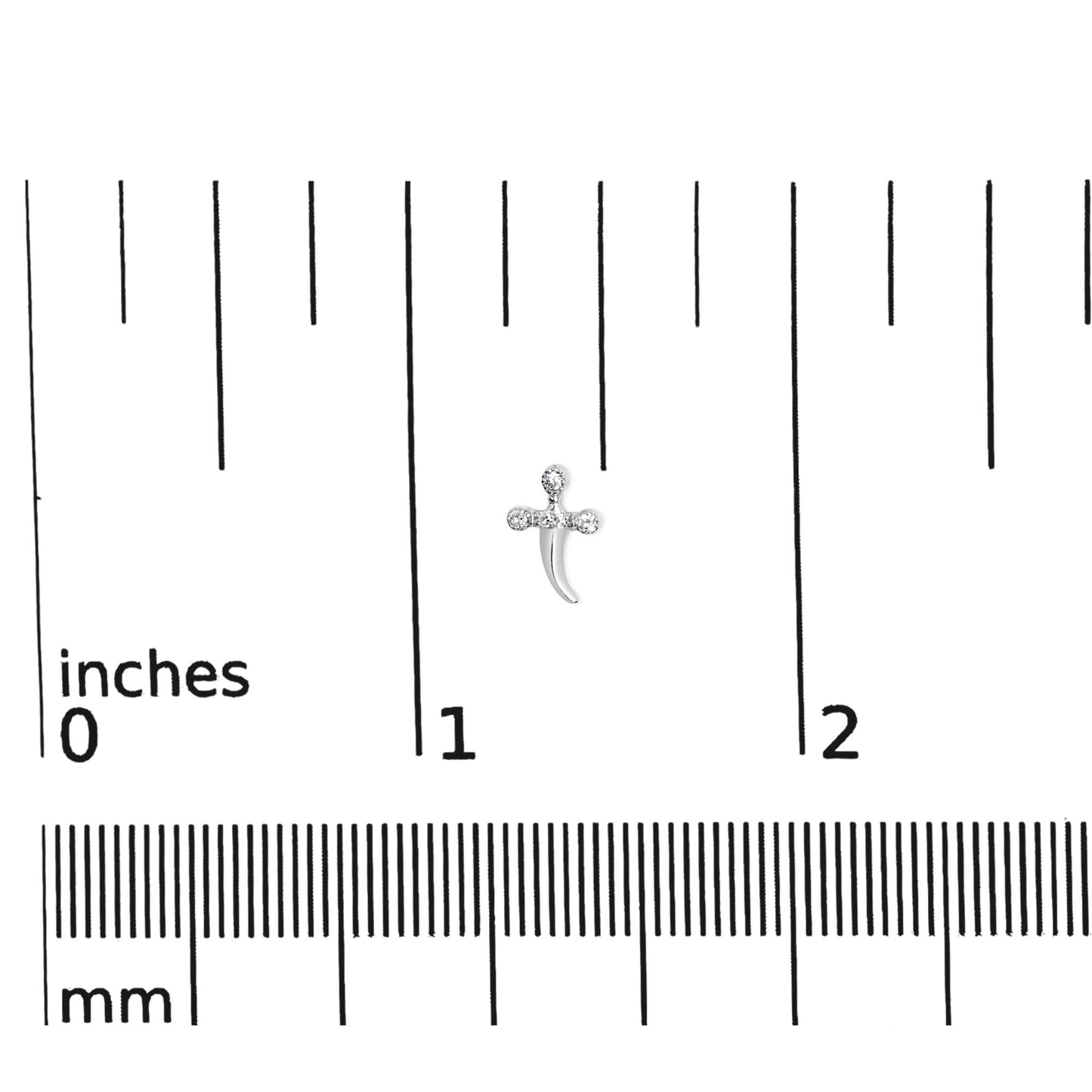 White metal earring with round white gemstones in prong settings, shown on a ruler for size reference, top-down angle.