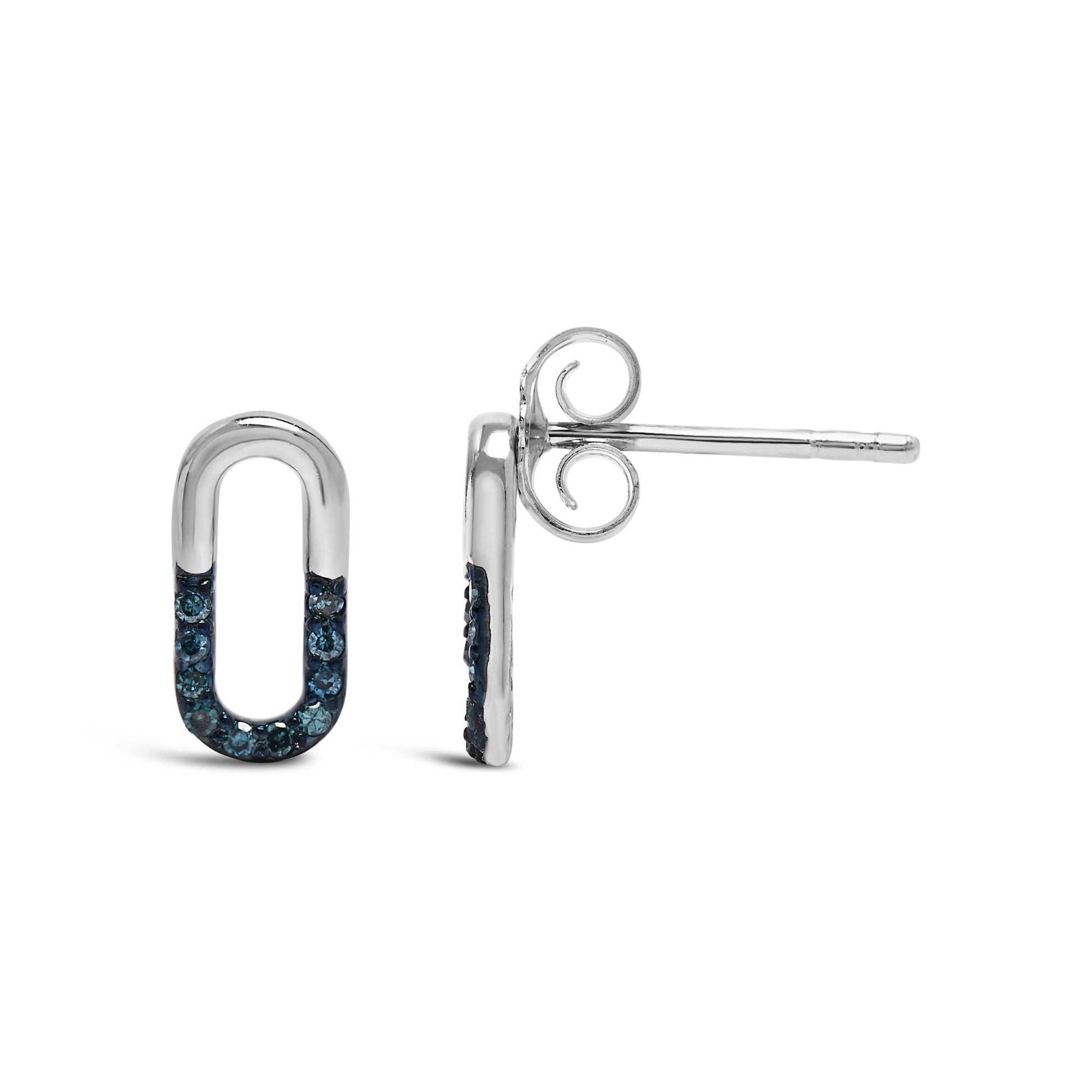 Front and side views of white metal oval-shaped stud earrings with blue round gemstones in prong settings along the lower half.