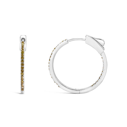 Front and side views of white metal hoop earrings with small round yellow gemstones set along the outer edge, shown on a white background.