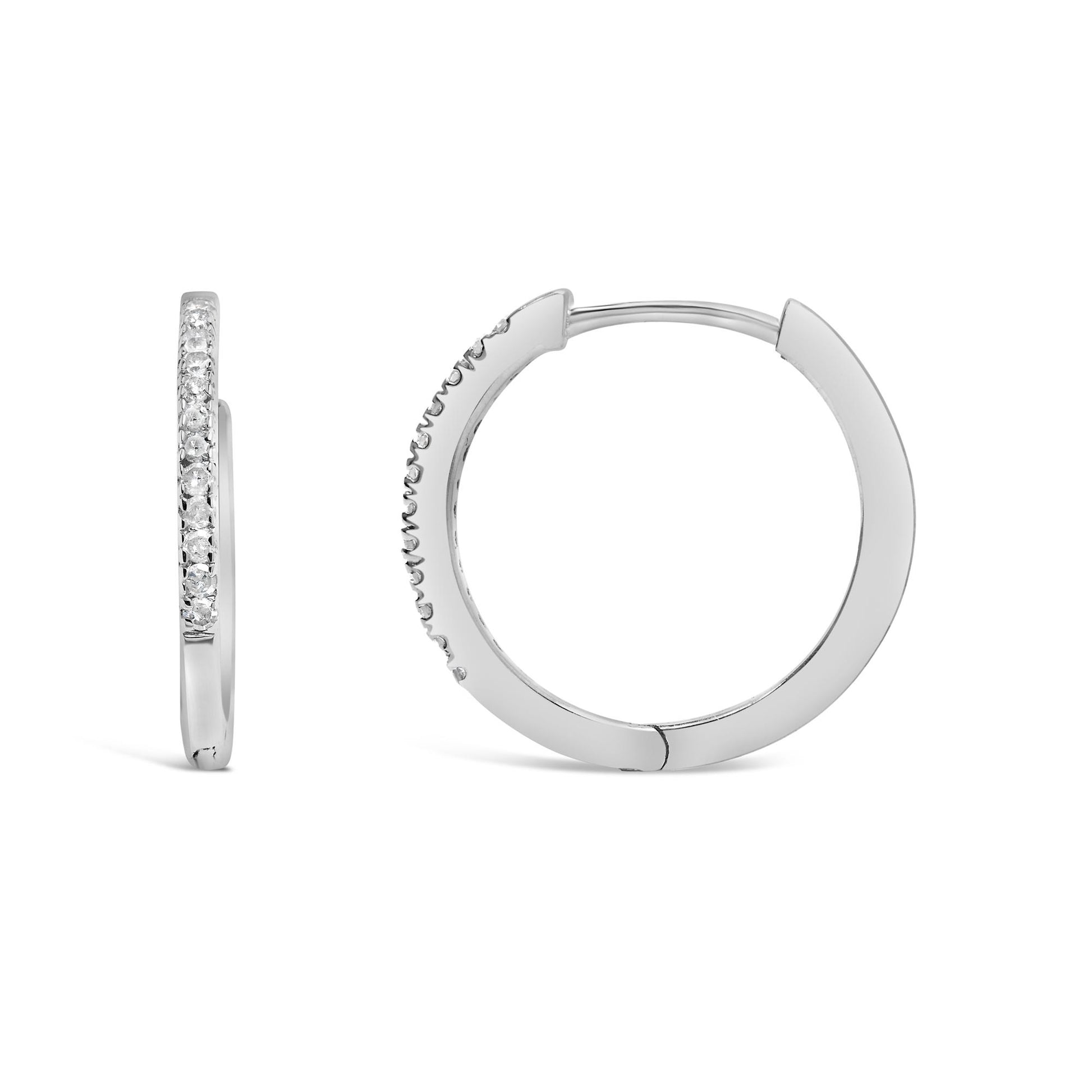 Front and side view of white metal hoop earrings with round white gemstones in prong settings, shown on a white background.