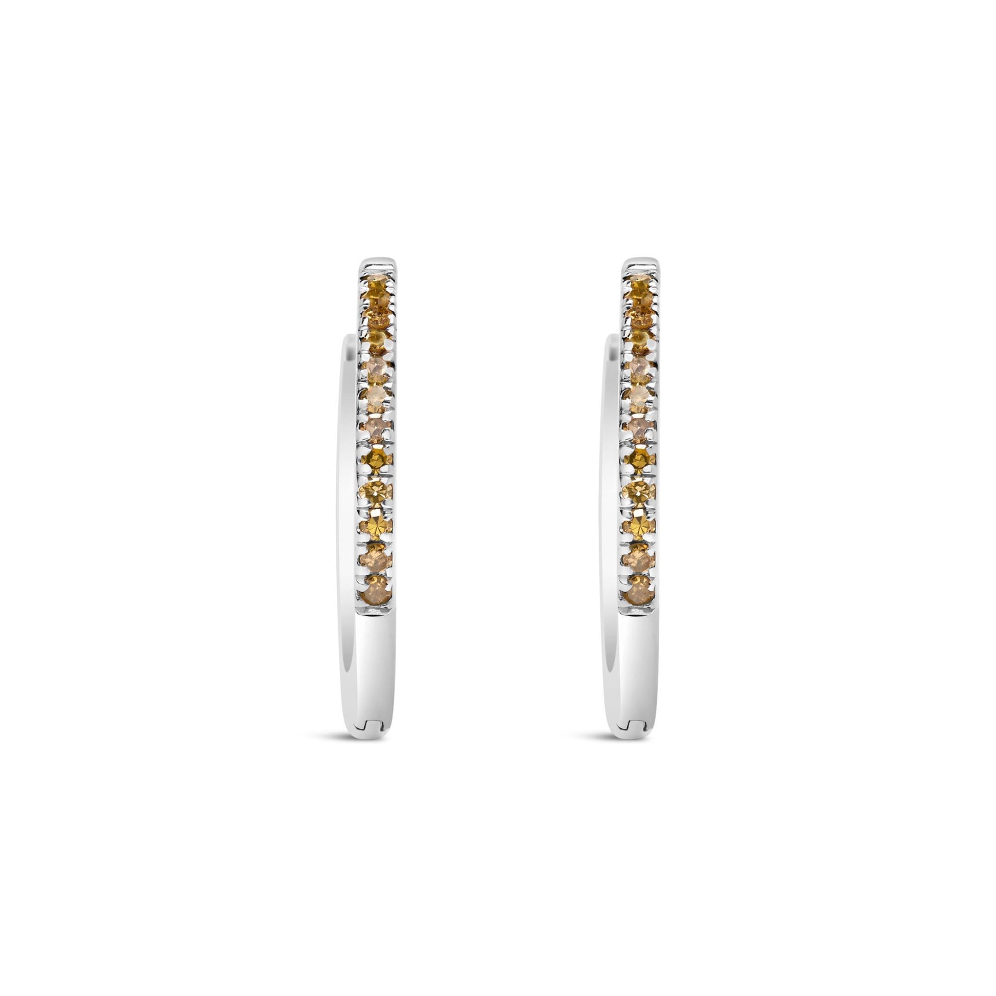 Front-facing shot of white metal hoop earrings with prong-set round yellow gemstones along the outer edge.