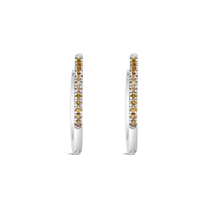 Front-facing shot of white metal hoop earrings with prong-set round yellow gemstones along the outer edge.