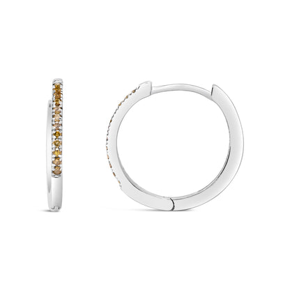 Front and side views of white metal hoop earrings with small round yellow gemstones in prong settings along the outer edge, shown on a white background.