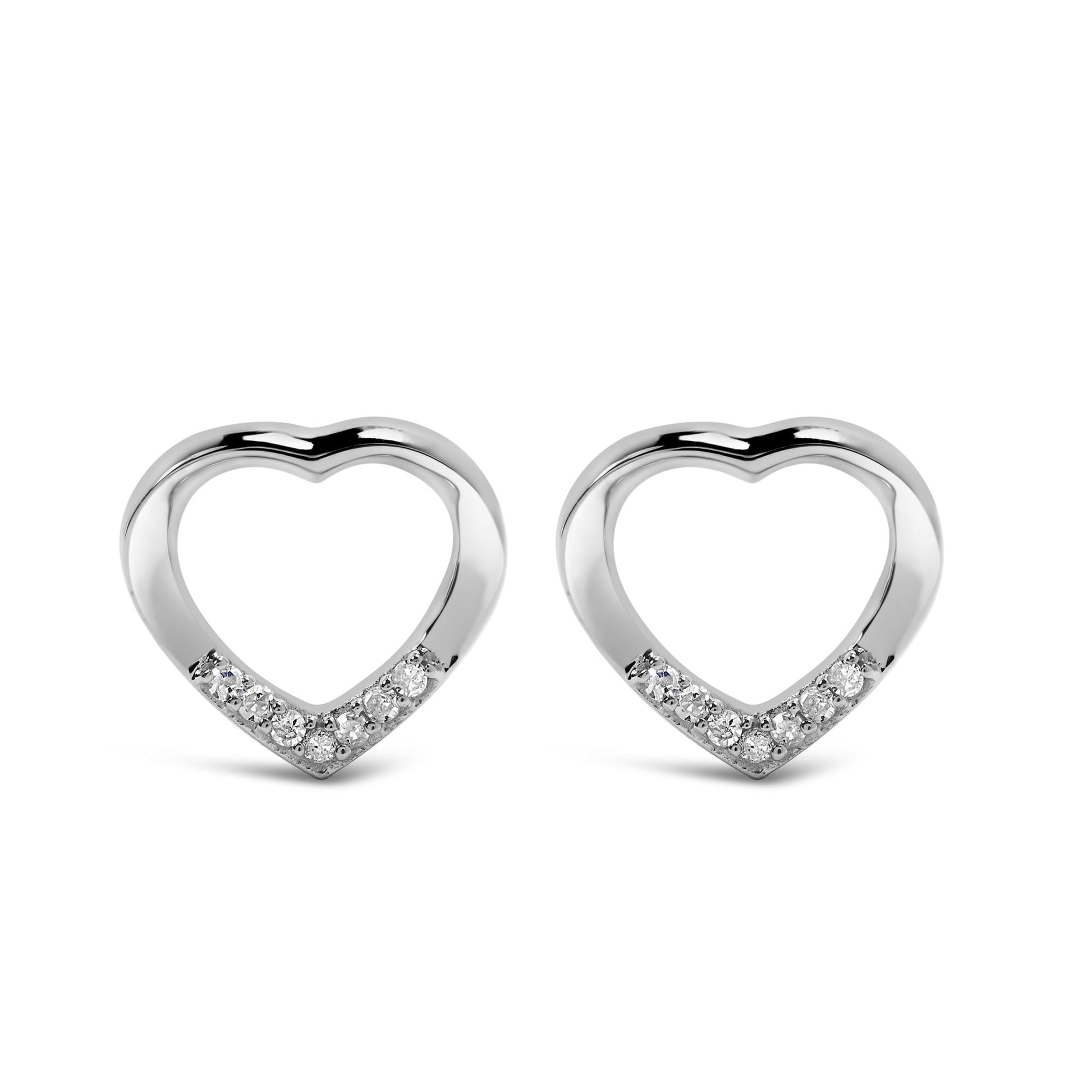 Front angle of white metal heart-shaped earrings with round prong-set white gemstones along the bottom edge.