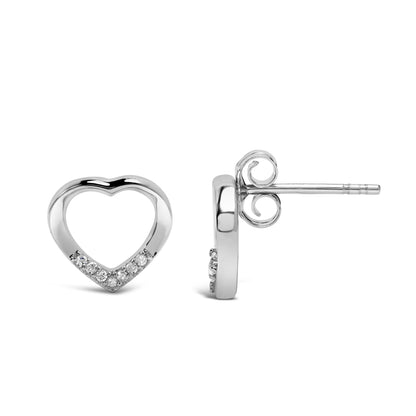 Front and side views of white metal heart-shaped stud earrings with round white gemstones set in prongs along the bottom curve, shown on a white background.