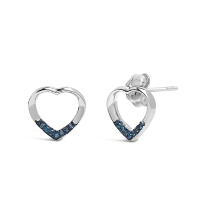 Pair of white metal heart-shaped stud earrings with blue round gemstones set along the bottom, shown in a front and angled side view on a white background.