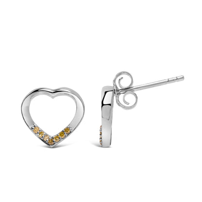 Front and side view of open heart-shaped white metal earrings with round yellow gemstones set along the bottom curve, shown against a white background.
