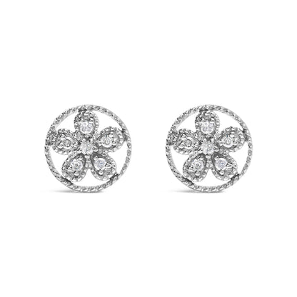 Front angle view of white metal round earrings with a flower design featuring round white gemstones in prong settings.