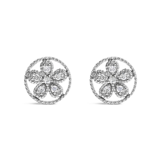 Front angle view of white metal round earrings with a flower design featuring round white gemstones in prong settings.