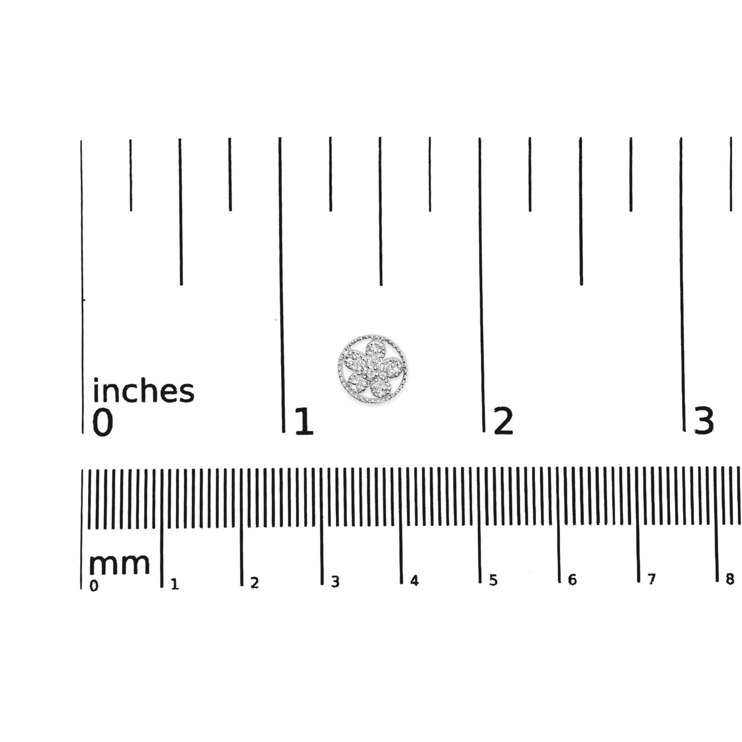 White metal round earrings with white gemstones in a floral pattern, shown on a ruler for size reference, top-down angle.