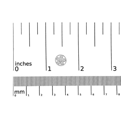 White metal round earrings with white gemstones in a floral pattern, shown on a ruler for size reference, top-down angle.