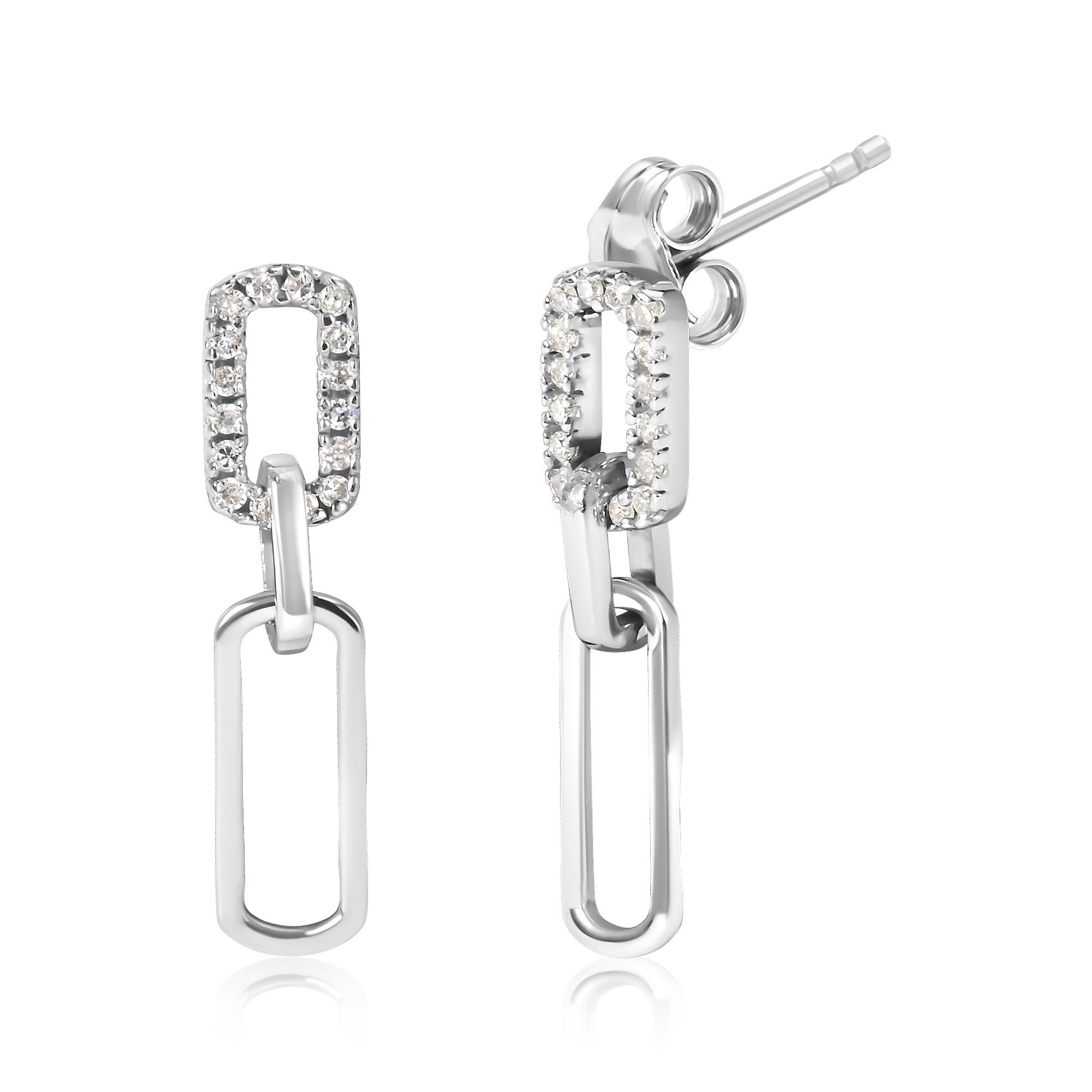 Front and side view of white metal dangle earrings with linked rectangular shapes, one rectangular link embellished with white round gemstones in prong setting.