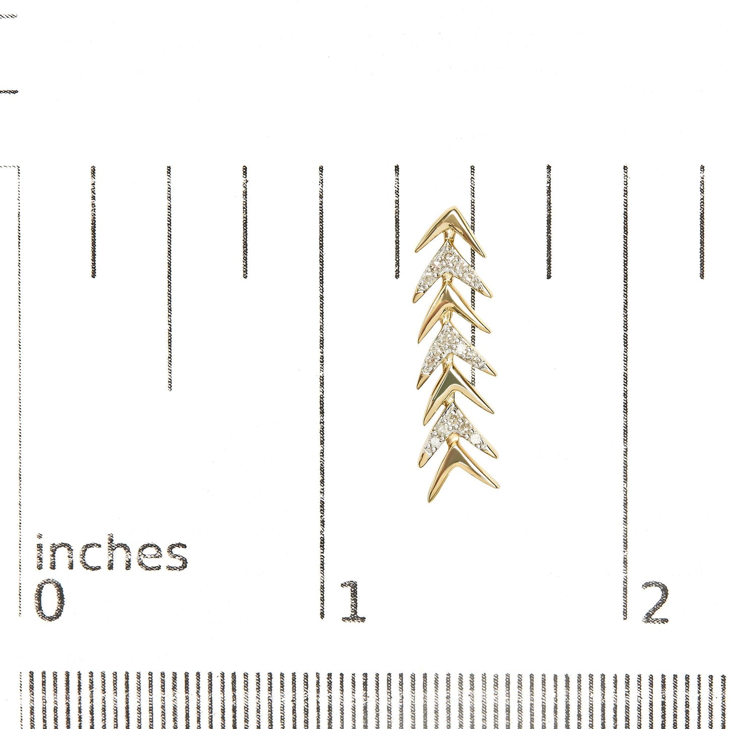 Yellow metal earrings with a chevron design, featuring multiple white round gemstones in prong settings, shown on a ruler for size reference, front angle.