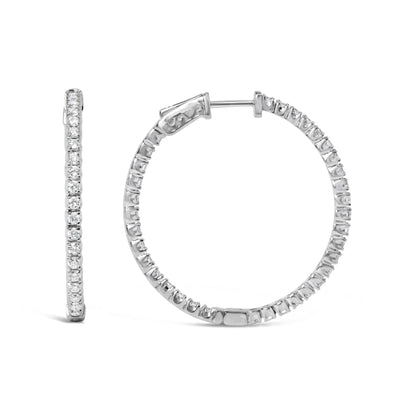 White metal hoop earrings with round white gemstones in prong settings, shown from front and side angles on a white background.