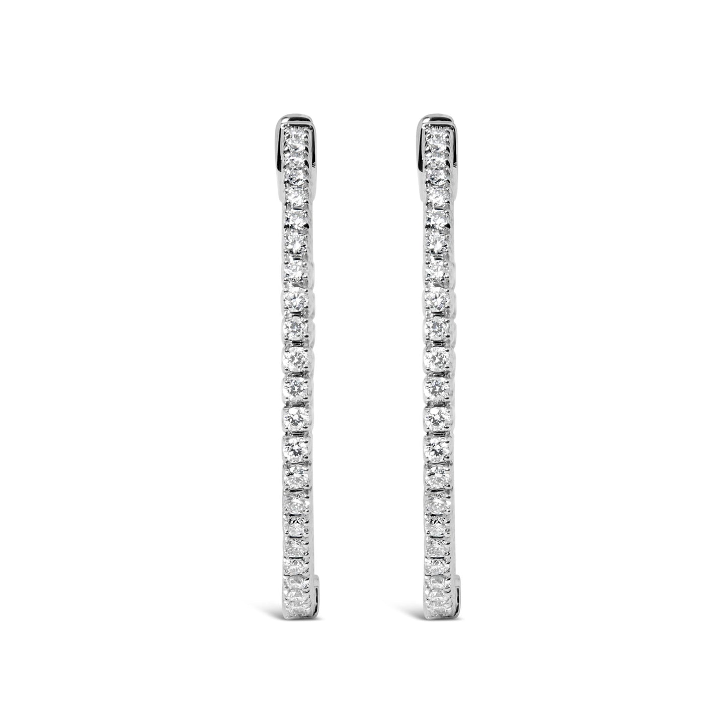Front-facing shot of white metal long thin earrings lined with round white gemstones in prong settings.