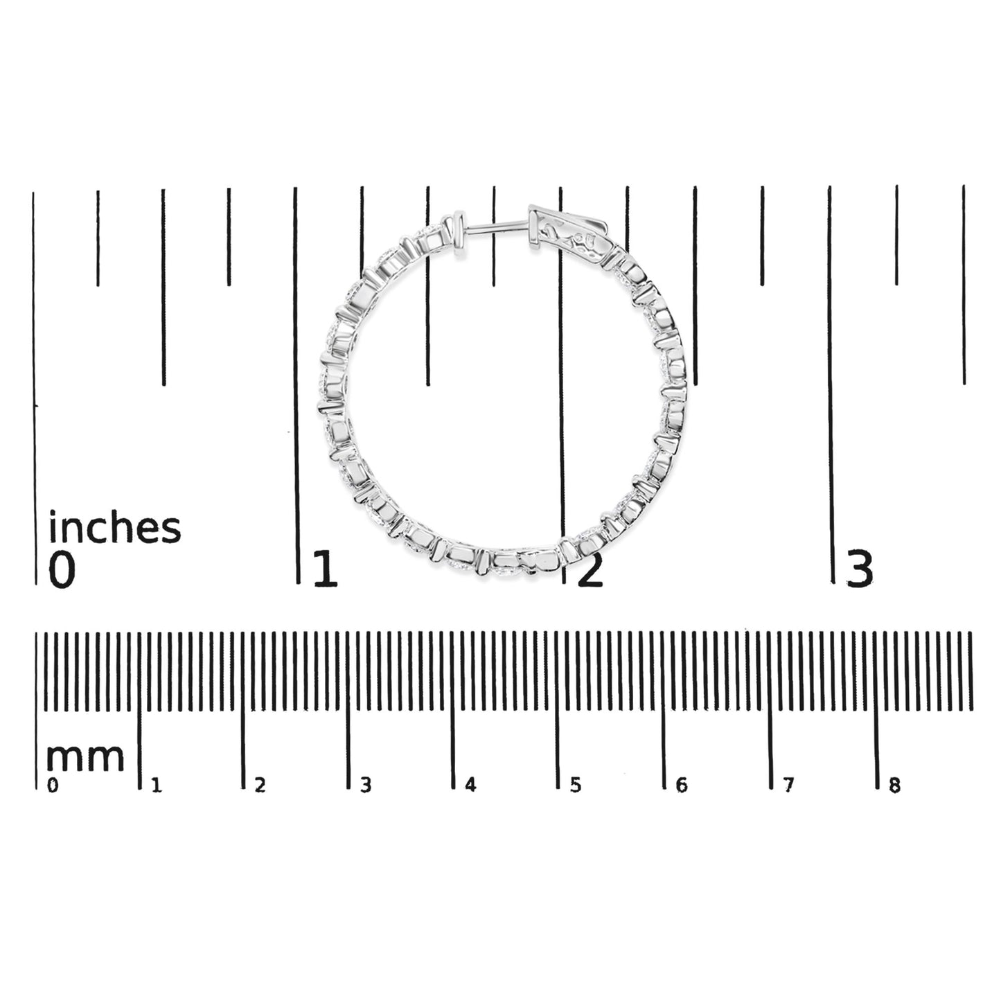 White metal hoop earring with round white gemstones in 2-prong settings, shown flat on a measurement scale, front view.