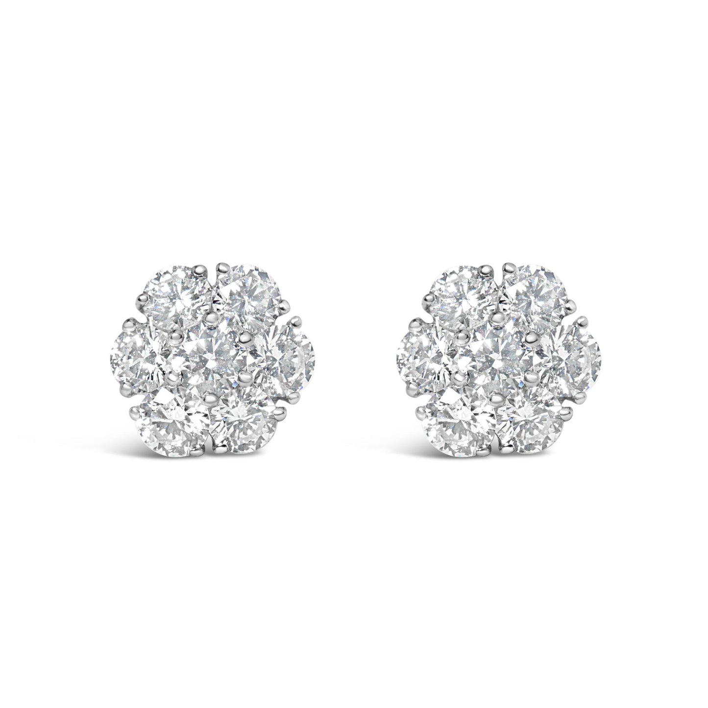 Front view of a pair of white metal cluster earrings featuring round white gemstones in prong settings.