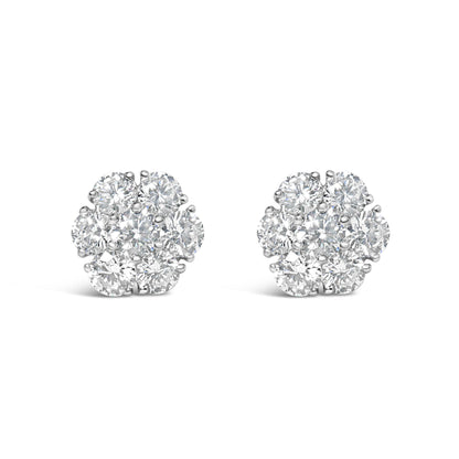 Front view of a pair of white metal cluster earrings featuring round white gemstones in prong settings.