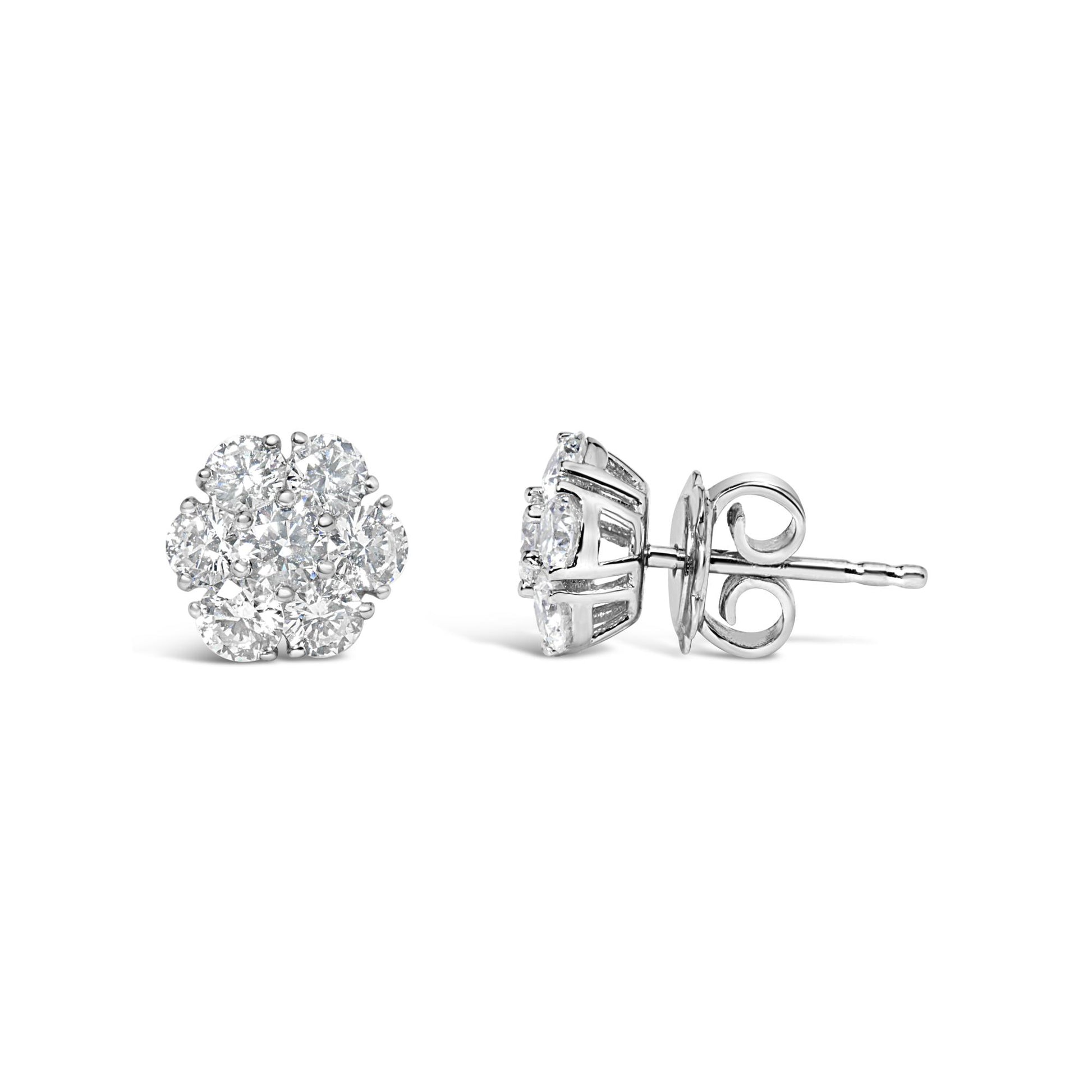 Pair of white metal round-shaped prong-set white gemstone cluster stud earrings shown from front and side angles.
