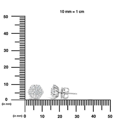 Pair of white metal stud earrings with round white gemstones in a prong setting, shown from front and side on a ruler for size reference.