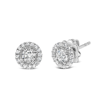 Pair of white metal stud earrings with round white gemstones in prong settings, shown in a front and angled side view on a white background.