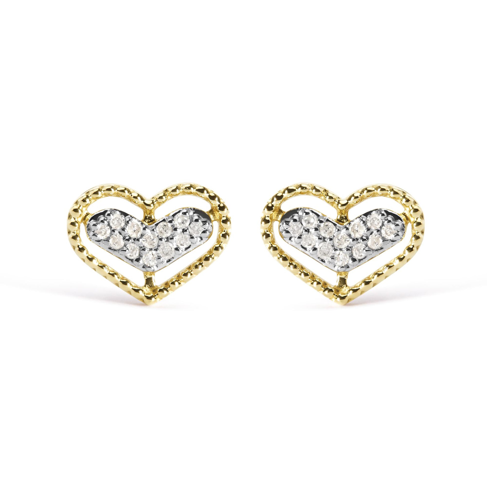 Front view of a pair of yellow metal heart-shaped earrings with inner heart filled with white round gemstones in prong settings.
