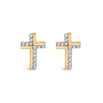 Front-facing shot of yellow metal cross-shaped earrings accented with white round gemstones in prong settings.