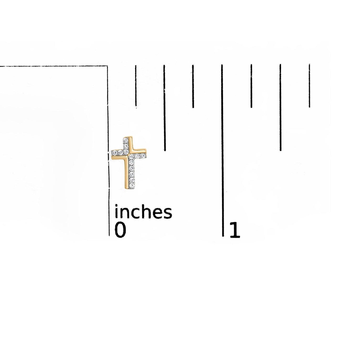 Yellow metal cross-shaped earring with white round gemstones in prong setting, shown on a ruler for size reference, front angle.