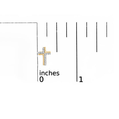 Yellow metal cross-shaped earring with white round gemstones in prong setting, shown on a ruler for size reference, front angle.