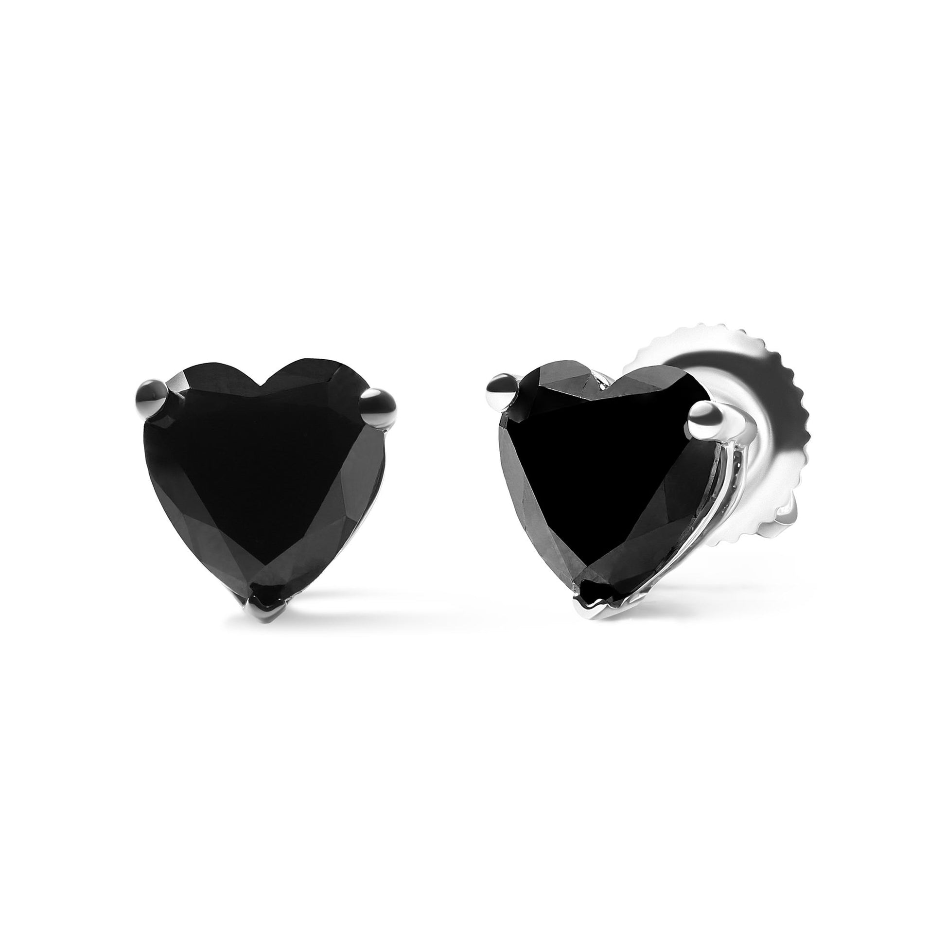 Close-up front and side angle of white metal stud earrings with heart-shaped black gemstones in prong settings.