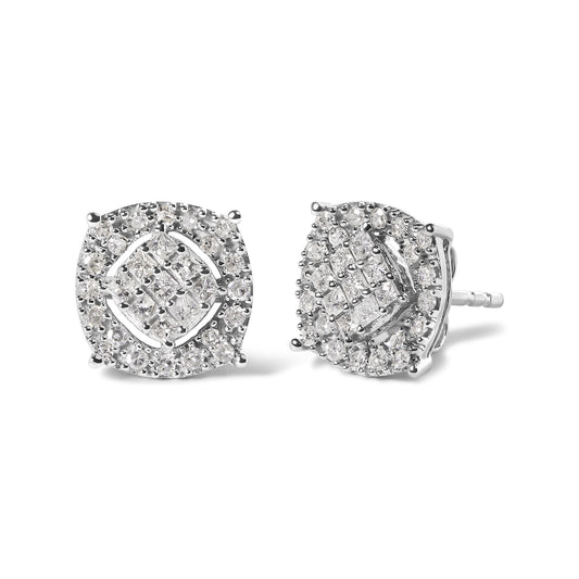 Pair of white metal stud earrings with square center cluster of princess-shaped white gemstones in invisible setting, surrounded by round white gemstones in prong setting, shown at a slight angle on a white background.
