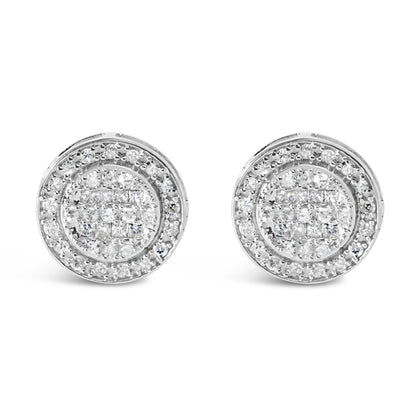 Front-facing view of white metal round stud earrings with central princess-shaped white gemstones in invisible setting, surrounded by two rows of round white gemstones in prong settings.