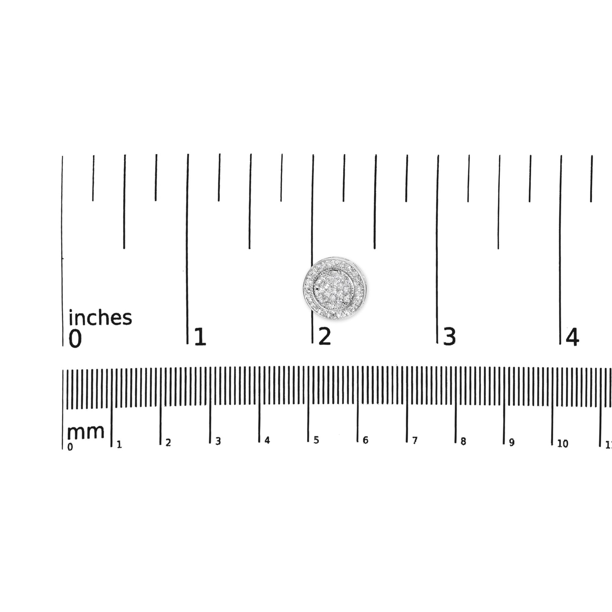 Top-down view of a single white metal round earring with two rows of white round gemstones on the outer edge and white princess-shaped gemstones clustered in the center, positioned on a ruler for size reference.