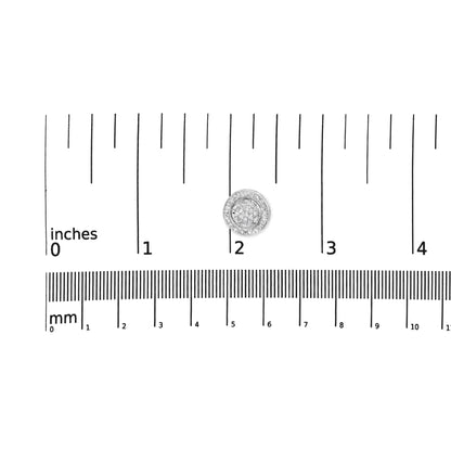 Top-down view of a single white metal round earring with two rows of white round gemstones on the outer edge and white princess-shaped gemstones clustered in the center, positioned on a ruler for size reference.
